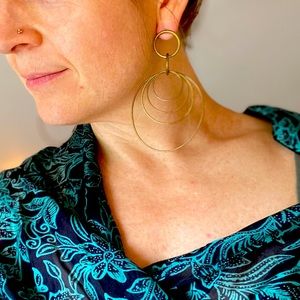 Rustic brass gold hoop earrings with many hoops